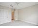 Clean, carpeted bedroom with a ceiling fan and two doors at 4100 Paces Se Walk # 2309, Atlanta, GA 30339