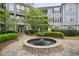 Elegant condo community with a central water fountain and manicured landscaping at 4100 Paces Se Walk # 2309, Atlanta, GA 30339
