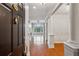 Inviting foyer with hardwood floors and elegant architectural details leads to the living area with a fireplace at 4100 Paces Se Walk # 2309, Atlanta, GA 30339