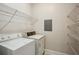 Functional laundry room with washer, dryer, and ample shelving at 4100 Paces Se Walk # 2309, Atlanta, GA 30339