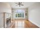 Bright living room with hardwood floors, fireplace, and built-in shelving showcases the space's modern appeal at 4100 Paces Se Walk # 2309, Atlanta, GA 30339