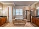 Bathroom features a soaking tub, shower, dual vanities, and tile accents at 6186 Talmadge Nw Run, Acworth, GA 30101