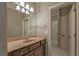 This bathroom includes a single sink vanity and a doorway to an adjacent room at 6186 Talmadge Nw Run, Acworth, GA 30101