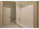 This bathroom features white tile, a shower with tub, and a toilet at 6186 Talmadge Nw Run, Acworth, GA 30101