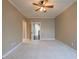 This bedroom features neutral walls, carpet flooring, a ceiling fan, and white trim at 6186 Talmadge Nw Run, Acworth, GA 30101