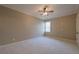 This carpeted bedroom features a ceiling fan and a window that lets in natural light at 6186 Talmadge Nw Run, Acworth, GA 30101