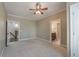 Bedroom with neutral carpet, walk-in closets, and views of ensuite bathroom at 6186 Talmadge Nw Run, Acworth, GA 30101