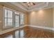 Bright bedroom with large windows and a private balcony overlooking lush greenery at 6186 Talmadge Nw Run, Acworth, GA 30101