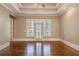 Spacious bedroom features tray ceilings, hardwood floors, and access to a private balcony at 6186 Talmadge Nw Run, Acworth, GA 30101