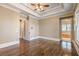 Spacious bedroom features tray ceilings, hardwood floors, and neutral color palette at 6186 Talmadge Nw Run, Acworth, GA 30101