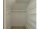 This walk-in closet offers ample storage with shelving units and hanging rods at 6186 Talmadge Nw Run, Acworth, GA 30101