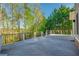 Outdoor wooden deck provides plenty of space and privacy with views of lush greenery at 6186 Talmadge Nw Run, Acworth, GA 30101