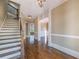 Inviting foyer with hardwood floors and a staircase at 6186 Talmadge Nw Run, Acworth, GA 30101