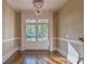 Foyer with hardwood floors, chandelier, and view of the front yard at 6186 Talmadge Nw Run, Acworth, GA 30101