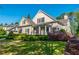 Charming two-story home with a well-manicured lawn and mature landscaping at 6186 Talmadge Nw Run, Acworth, GA 30101