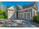 Three-car garage with painted doors at 6186 Talmadge Nw Run, Acworth, GA 30101