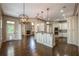 Spacious kitchen with an island and plenty of natural light flowing into an adjacent living room at 6186 Talmadge Nw Run, Acworth, GA 30101