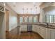 Kitchenette area features stainless dishwasher, granite counters and hanging pendant lights at 6186 Talmadge Nw Run, Acworth, GA 30101