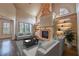 Spacious living room features brick fireplace, hardwood floors, built-in shelving and comfortable seating at 6186 Talmadge Nw Run, Acworth, GA 30101