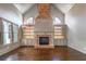 Spacious living room with vaulted ceiling, hardwood floors, fireplace and custom built-ins at 6186 Talmadge Nw Run, Acworth, GA 30101