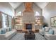 Staged living room showcasing a brick fireplace and built-in shelving at 6186 Talmadge Nw Run, Acworth, GA 30101