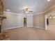 Spacious living room with neutral tones, crown molding, and an open layout for easy entertaining at 6186 Talmadge Nw Run, Acworth, GA 30101
