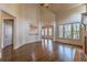 Spacious living room with vaulted ceilings, a brick fireplace, and large windows overlooking the yard at 6186 Talmadge Nw Run, Acworth, GA 30101