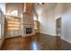 Bright living room with hardwood floors and a brick fireplace at 6186 Talmadge Nw Run, Acworth, GA 30101