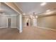 Large living area with neutral paint, recessed lighting, with views into a bathroom and dinning area at 6186 Talmadge Nw Run, Acworth, GA 30101