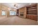 Cozy living room with a stone fireplace and built-in bookshelves at 6186 Talmadge Nw Run, Acworth, GA 30101