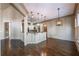 Open-concept living space with hardwood floors and views to the kitchen at 6186 Talmadge Nw Run, Acworth, GA 30101