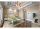 Well-decorated bedroom offers hardwood floors, a ceiling fan, and beautiful decorative touches at 6186 Talmadge Nw Run, Acworth, GA 30101