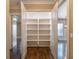 Walk-in pantry with open shelving at 6186 Talmadge Nw Run, Acworth, GA 30101
