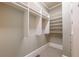 Spacious walk-in closet with built-in shelving and ample storage space for an organized wardrobe at 6186 Talmadge Nw Run, Acworth, GA 30101