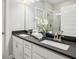 Bathroom featuring double sinks, granite counters and a glass enclosed shower at 709 Bismark Ne Rd, Atlanta, GA 30324