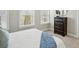 Cozy bedroom featuring natural light, a dresser, and neutral decor at 709 Bismark Ne Rd, Atlanta, GA 30324