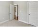 Carpeted bedroom features an ensuite bath through a door at 709 Bismark Ne Rd, Atlanta, GA 30324