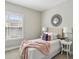 Comfortable bedroom features an accent mirror and white nightstands at 709 Bismark Ne Rd, Atlanta, GA 30324