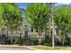 Charming townhome exterior with brick facade and manicured landscaping creating inviting curb appeal at 709 Bismark Ne Rd, Atlanta, GA 30324