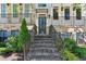Inviting townhome featuring a welcoming entrance, detailed brickwork, and a well-manicured garden at 709 Bismark Ne Rd, Atlanta, GA 30324