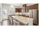Well-equipped kitchen with stainless steel appliances, granite countertops, and bar stool seating at 709 Bismark Ne Rd, Atlanta, GA 30324
