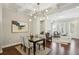 Bright living room featuring stylish lighting, dining area, and seamless flow throughout the home at 709 Bismark Ne Rd, Atlanta, GA 30324