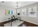 Bright office space featuring a glass desk, modern lighting, and multiple windows for ample natural light at 709 Bismark Ne Rd, Atlanta, GA 30324