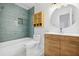 Modern bathroom features updated vanity, fixtures, and stylish tile surround in tub and shower at 3264 Henderson Mill Rd # C, Atlanta, GA 30341