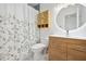 Modern bathroom with a vanity, decorative mirror, and stylish shower curtain at 3264 Henderson Mill Rd # C, Atlanta, GA 30341