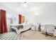 Bright bedroom featuring a ceiling fan, large window, and a functional workspace at 3264 Henderson Mill Rd # C, Atlanta, GA 30341