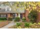 Charming brick townhome with well-maintained landscaping, welcoming curb appeal at 3264 Henderson Mill Rd # C, Atlanta, GA 30341