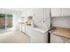 Bright kitchen with white cabinets, modern appliances, and a sliding door to the patio at 3264 Henderson Mill Rd # C, Atlanta, GA 30341
