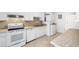 Clean, white kitchen with updated appliances, lots of cabinet space and washer and dryer at 3264 Henderson Mill Rd # C, Atlanta, GA 30341