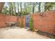 Private outdoor patio space enclosed by brick walls, perfect for relaxing or entertaining at 3264 Henderson Mill Rd # C, Atlanta, GA 30341